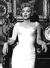 https://upload.wikimedia.org/wikipedia/commons/thumb/4/4f/Marilyn_Monroe%2C_The_Prince_and_the_Showgirl%2C_2_140x190.jpg/100px-Marilyn_Monroe%2C_The_Prince_and_the_Showgirl%2C_2_140x190.jpg